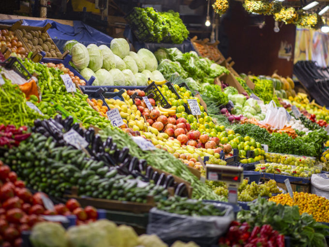 Colorful view of greengrocery counter with several fruits and vegetables